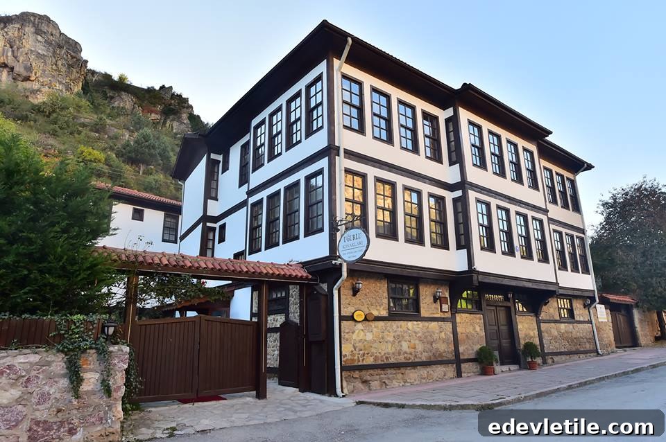Beautifully preserved three-story Ottoman mansion in Kastamonu, now serving as a boutique hotel with wooden trim and stone foundation.