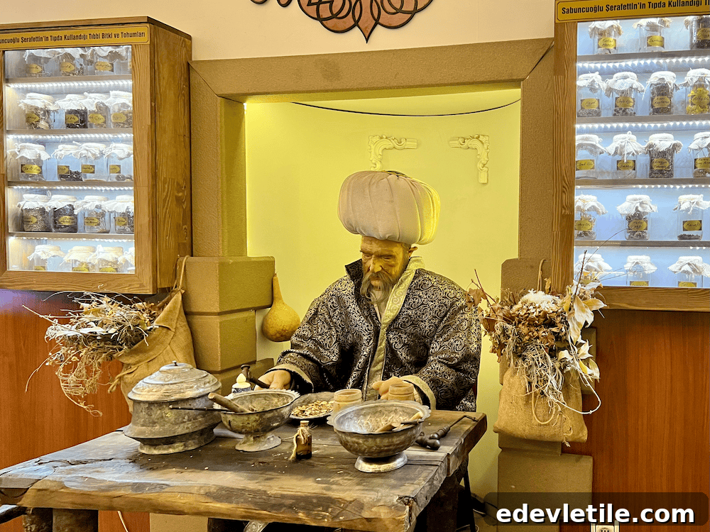 Wax figure of Sabuncuoğlu Şerafeddin, a historic Ottoman physician, surrounded by herbal jars and tools at the Amasya Medical History Museum.