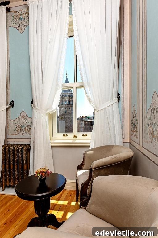 Vintage-style lounge corner with white curtains and a framed view of Galata Tower in the distance.