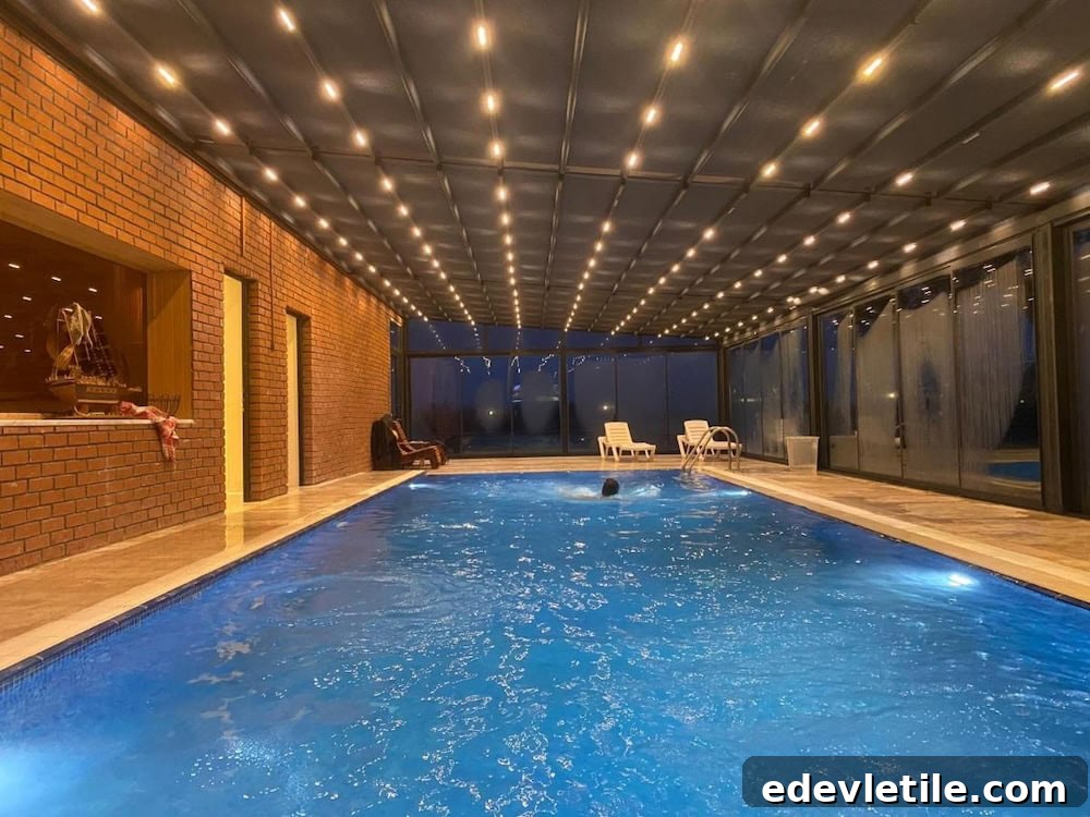 Spacious indoor swimming pool with warm lighting, brick walls, and lounge chairs, ideal for relaxing near Istanbul Airport.