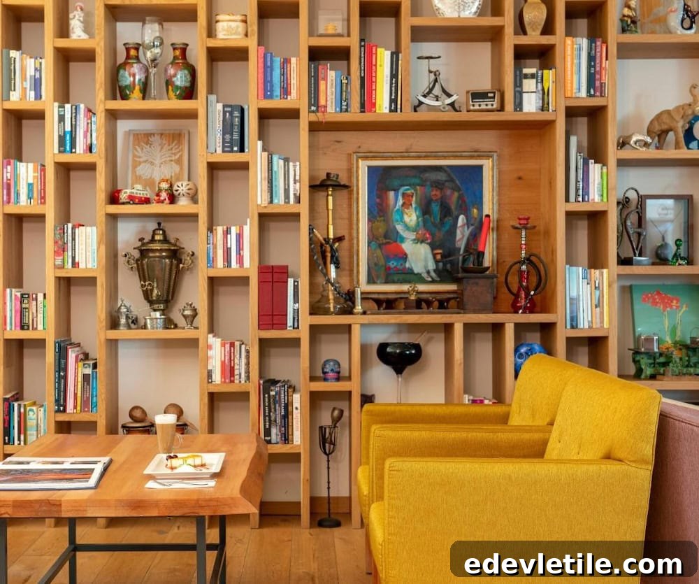 Stylish hotel lounge featuring a colorful library wall, cozy yellow armchairs, and eclectic Turkish decor near Istanbul Airport.