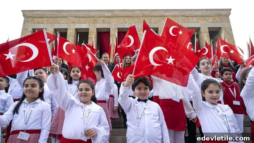 A group of children dressed in red and white hold Turkish flags on the steps of Anıtkabir, the mausoleum of Atatürk, during National Sovereignty and Children's Day.