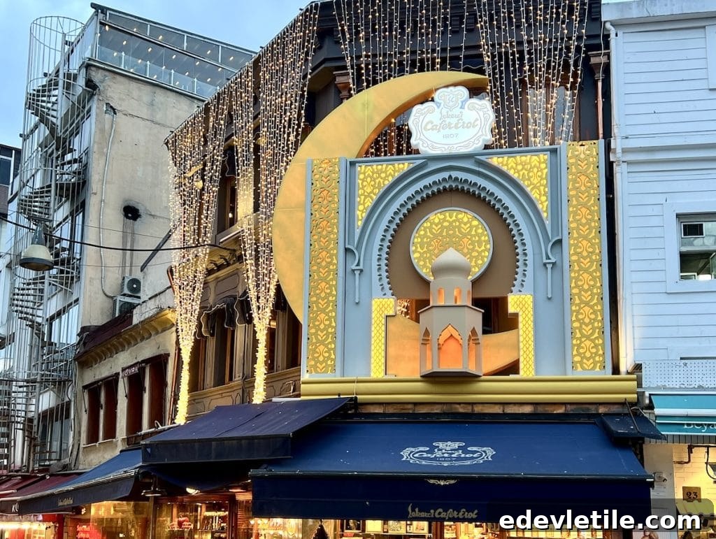 Ramadan-themed light display of Cafe Erol in Istanbul, featuring golden decorations, lights, and a large crescent moon design over the entrance.