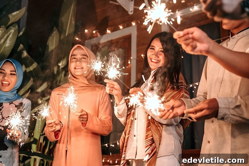 Group of smiling people holding sparklers during Ramadan celebrations, with festive lights strung in the background.