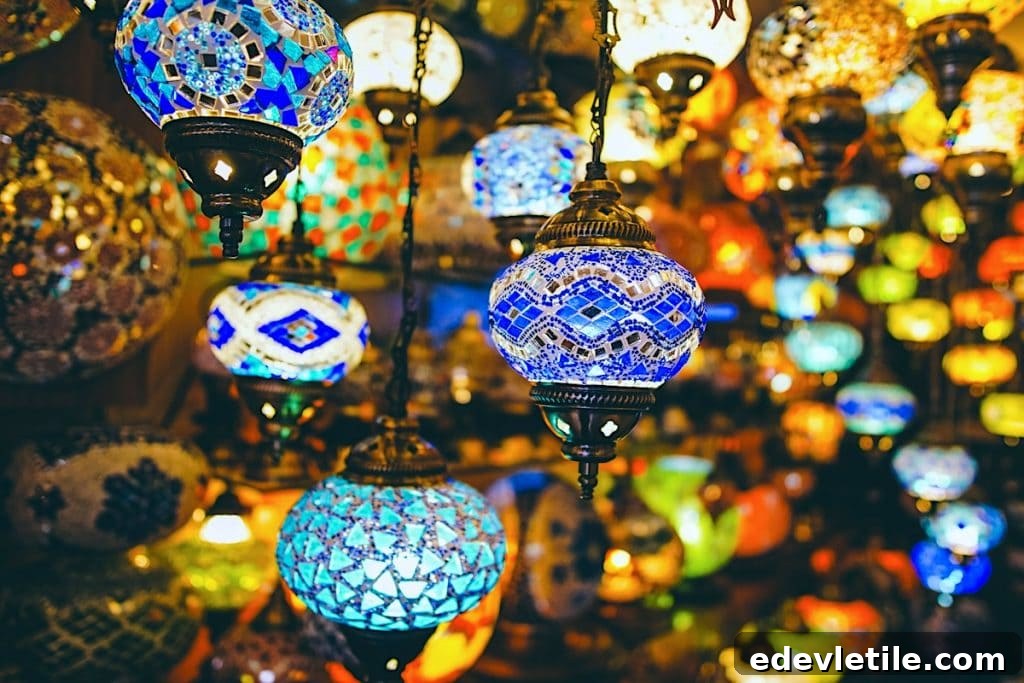 Colorful mosaic Turkish lamps hanging in a shop, glowing warmly in a variety of rich blues, oranges, and greens—often seen during Ramadan and Eid shopping.