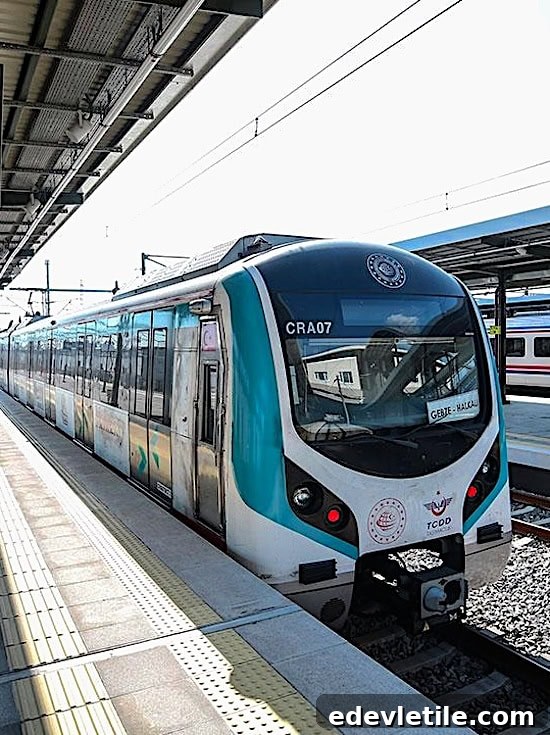 Modern Marmaray train at the platform with Gebze Halkali displayed on the front and TCDD logo visible.