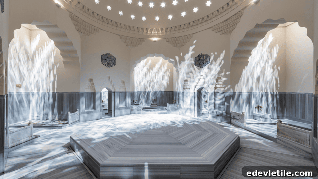 Sunlight filters through a dome of star-shaped cutouts, casting shimmering patterns across the central marble platform of Zeyrek Çinili Hamam’s bright and spacious interior.