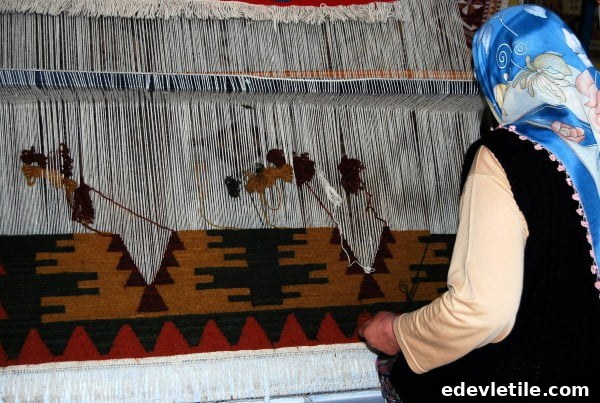 Woman making Turkish carpet