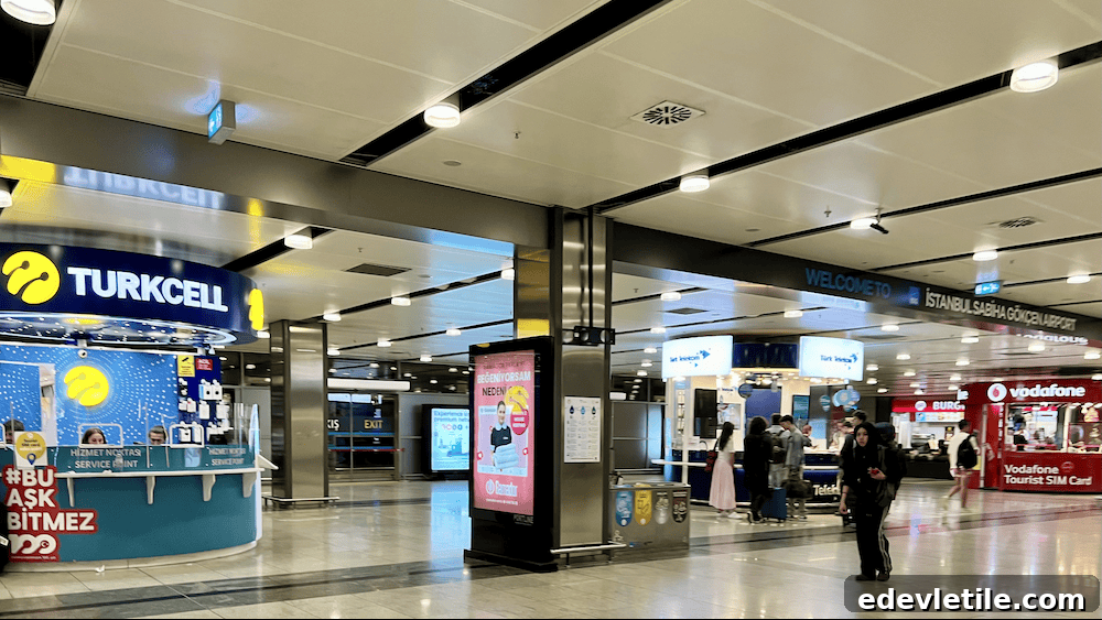 Turkcell, Türk Telekom, and Vodafone SIM card booths inside Istanbul Sabiha Gökçen Airport.