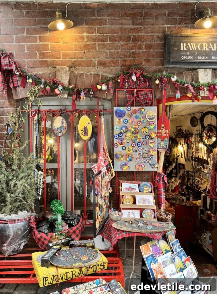 Cozy, eclectic display outside RAWCRAFTS in Balat featuring handmade magnets, ornaments, postcards, and colorful plaid decor under warm string lights.