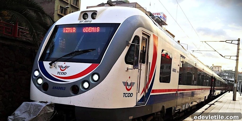 TCDD regional train at a station platform with digital signage displaying “İzmir Ödemiş,” part of Turkey’s national rail system.