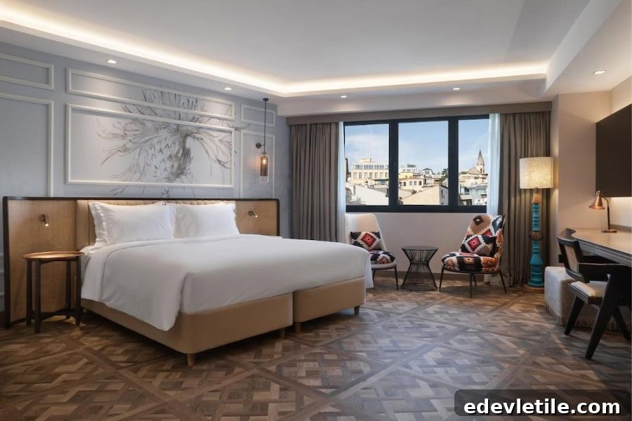 Spacious king room at Burdock Hotel Istanbul featuring a statement headboard, parquet floors, designer lighting, and city views through large windows.