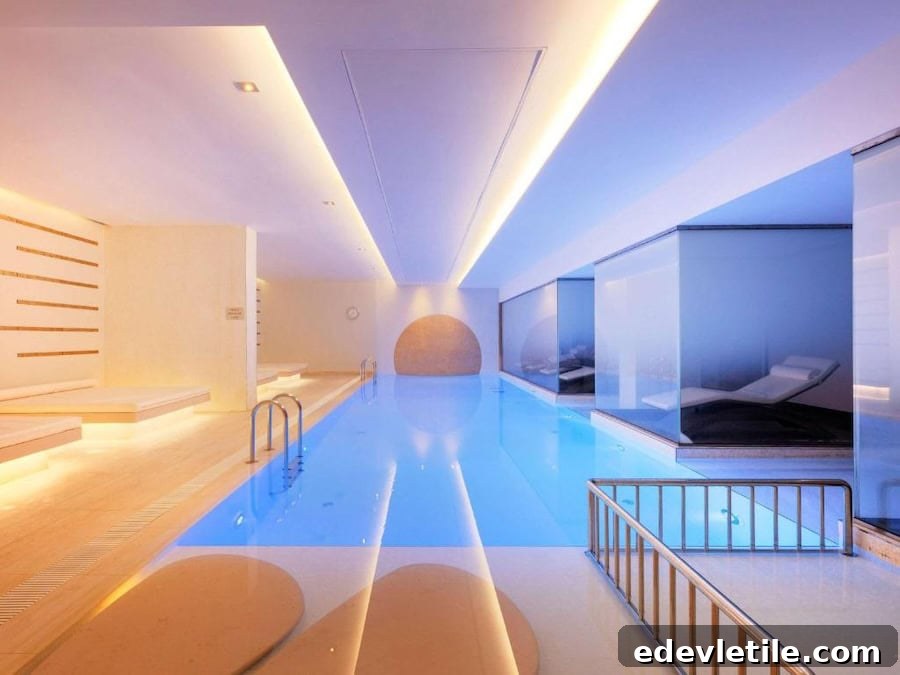 Serene indoor spa pool at Novotel Istanbul Bosphorus with modern lighting and minimalist lounge areas.