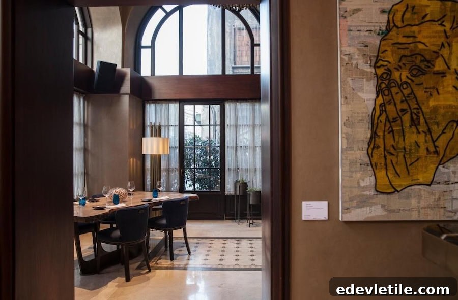 Stylish private dining area at 10 Karaköy Hotel with arched windows, a statement art piece, and a refined, intimate atmosphere.