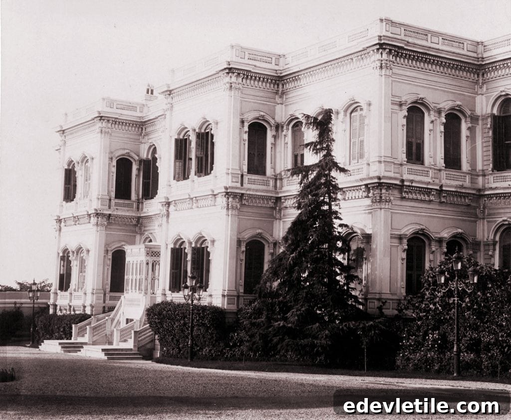 Vintage black-and-white photograph of Yıldız Palace’s exterior, capturing its original condition and lush landscaping in Ottoman times.