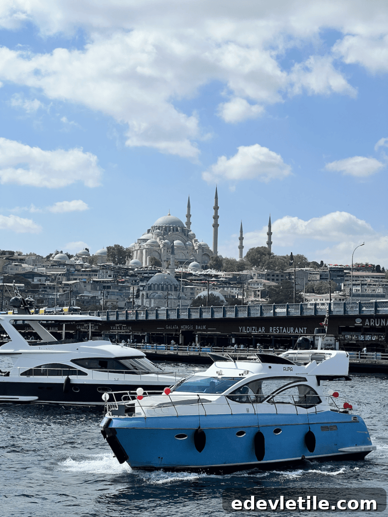 Boats cruise along the Bosphorus in Istanbul, with the skyline of mosques and minarets visible in the background under a partly cloudy sky.