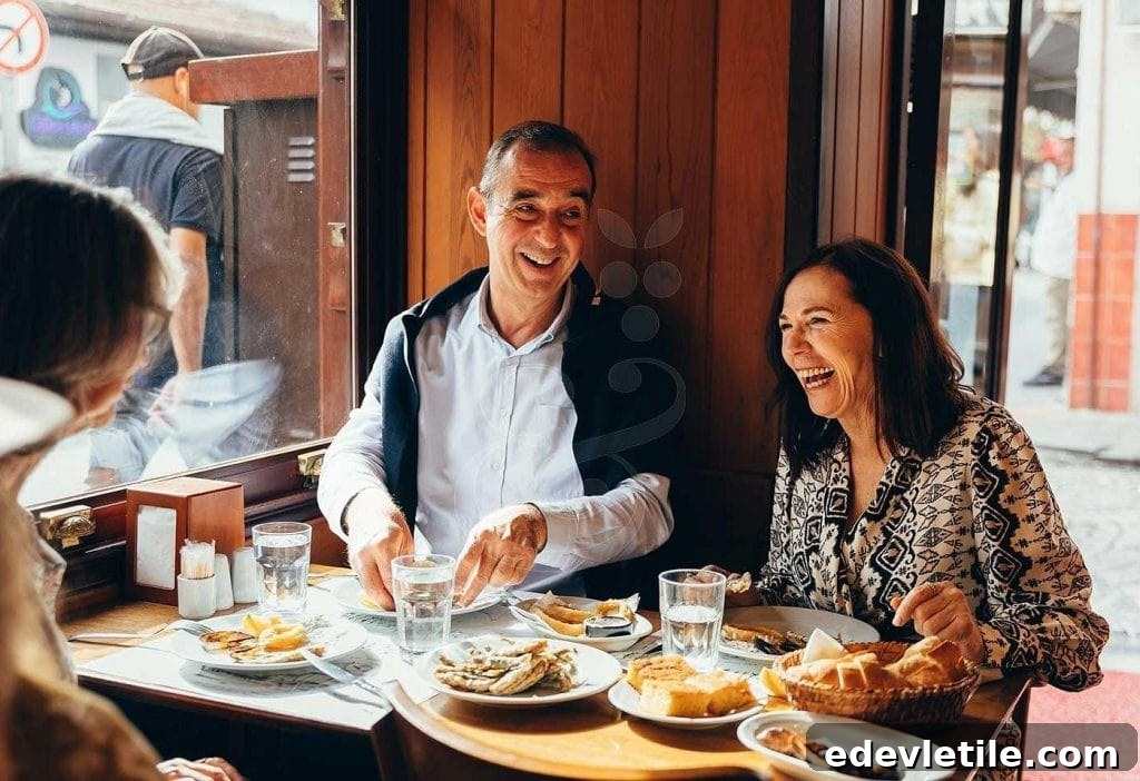 A smiling group of adults enjoys a casual Turkish meal at a cozy wooden-windowed restaurant, with plates of fish, bread, and meze on the table during their food tour of Istanbul