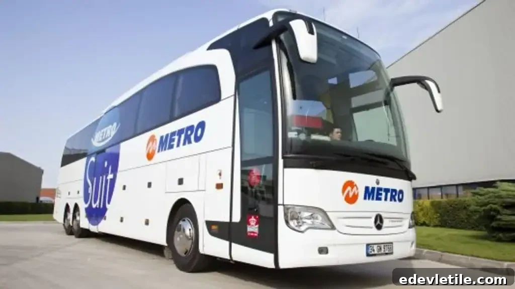 A Metro Turizm intercity bus parked at a terminal, with a white and blue exterior and “Suit” written on the side near the front entrance.