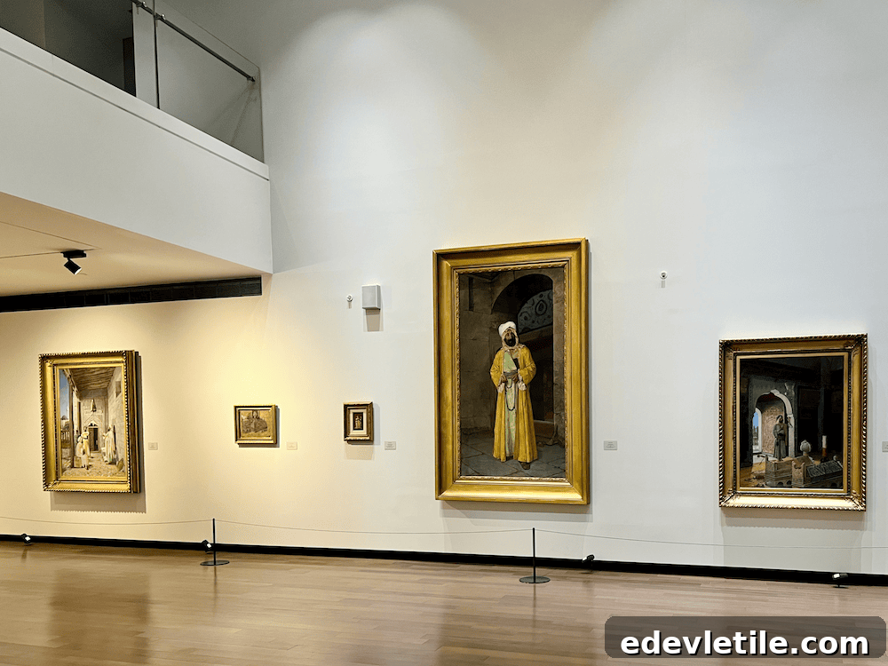 Interior shot of Istanbul Museum of Painting and Sculpture, showcasing framed oriental-style paintings on a white wall in a quiet gallery space with wooden floors.