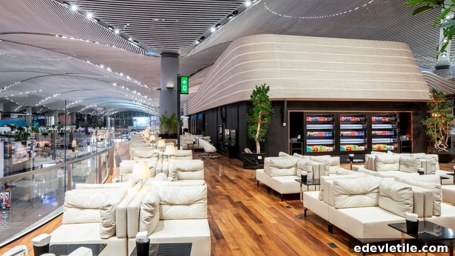 Spacious Turkish Airlines lounge at Istanbul Airport with white leather seating wooden floors and large windows offering a comfortable place to relax