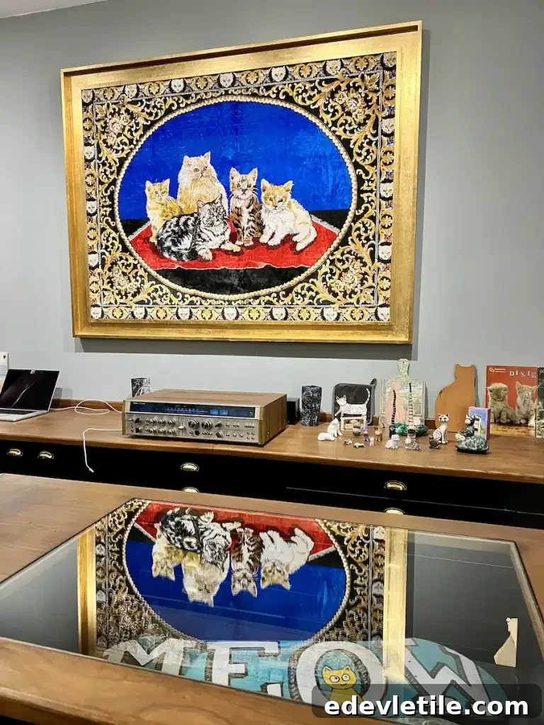 Framed tapestry of cats hanging above a retro-style desk inside a quirky shop in the Istanbul Cat Museum