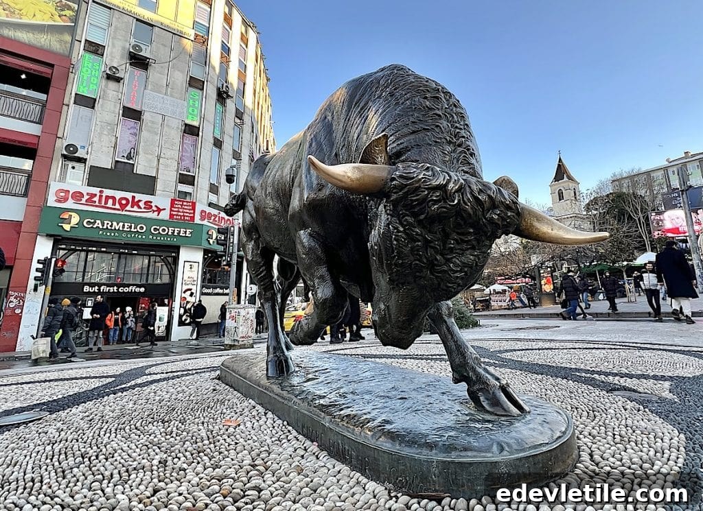 Bronze bull statue in the center of a busy square in Kadikoy.