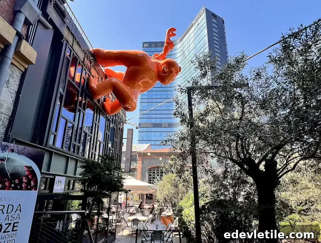 A fun, bright orange sculpture of a money mounted on a modern building in Bomonti, a trendy hipster district of Istanbul.