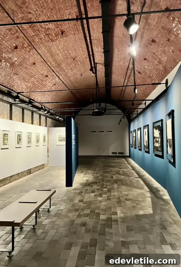 Minimalist photography gallery with an arched brick ceiling in Bomonti, one of Istanbul’s underrated cultural neighborhoods.