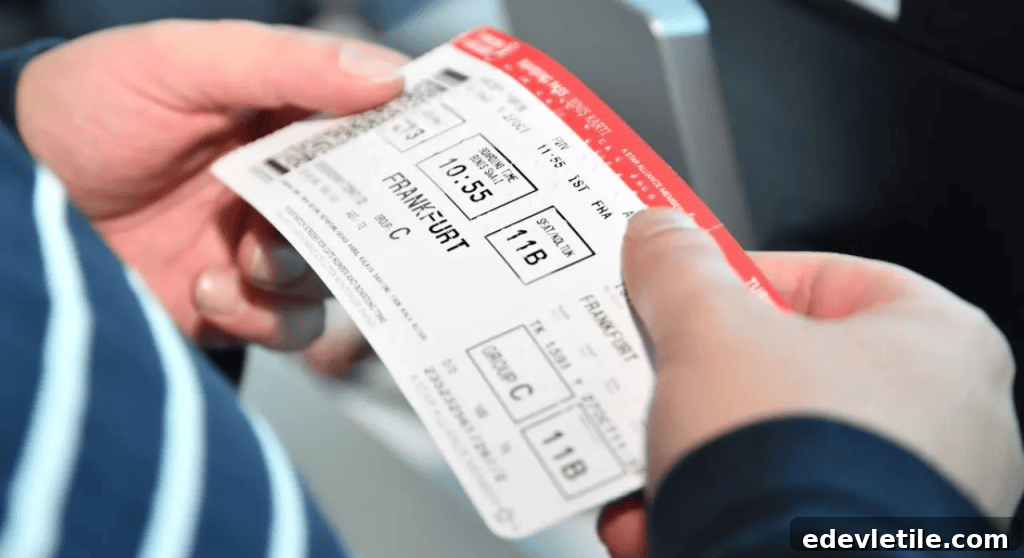 Close-up of a passenger holding a Turkish Airlines boarding pass for a domestic flight to Frankfurt, taken at the gate before boarding.